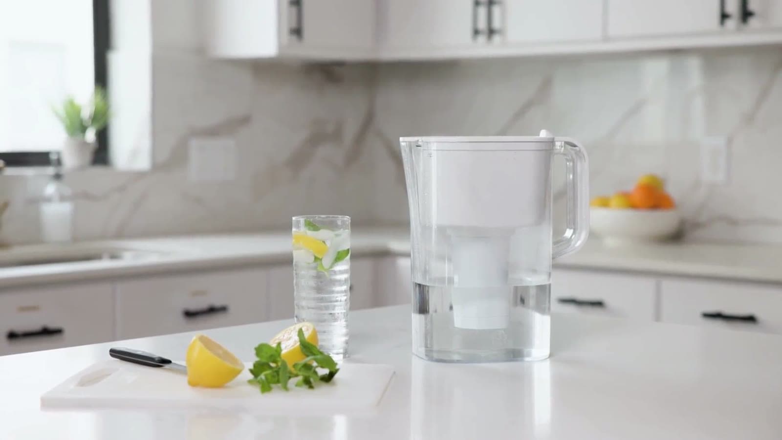 A glass of filtered water on a kitchen counter.